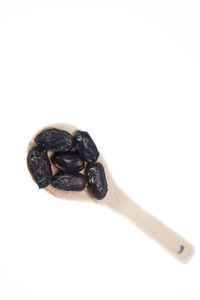 Close-up of coffee beans against white background