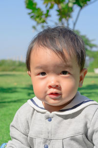 Portrait of cute boy in park