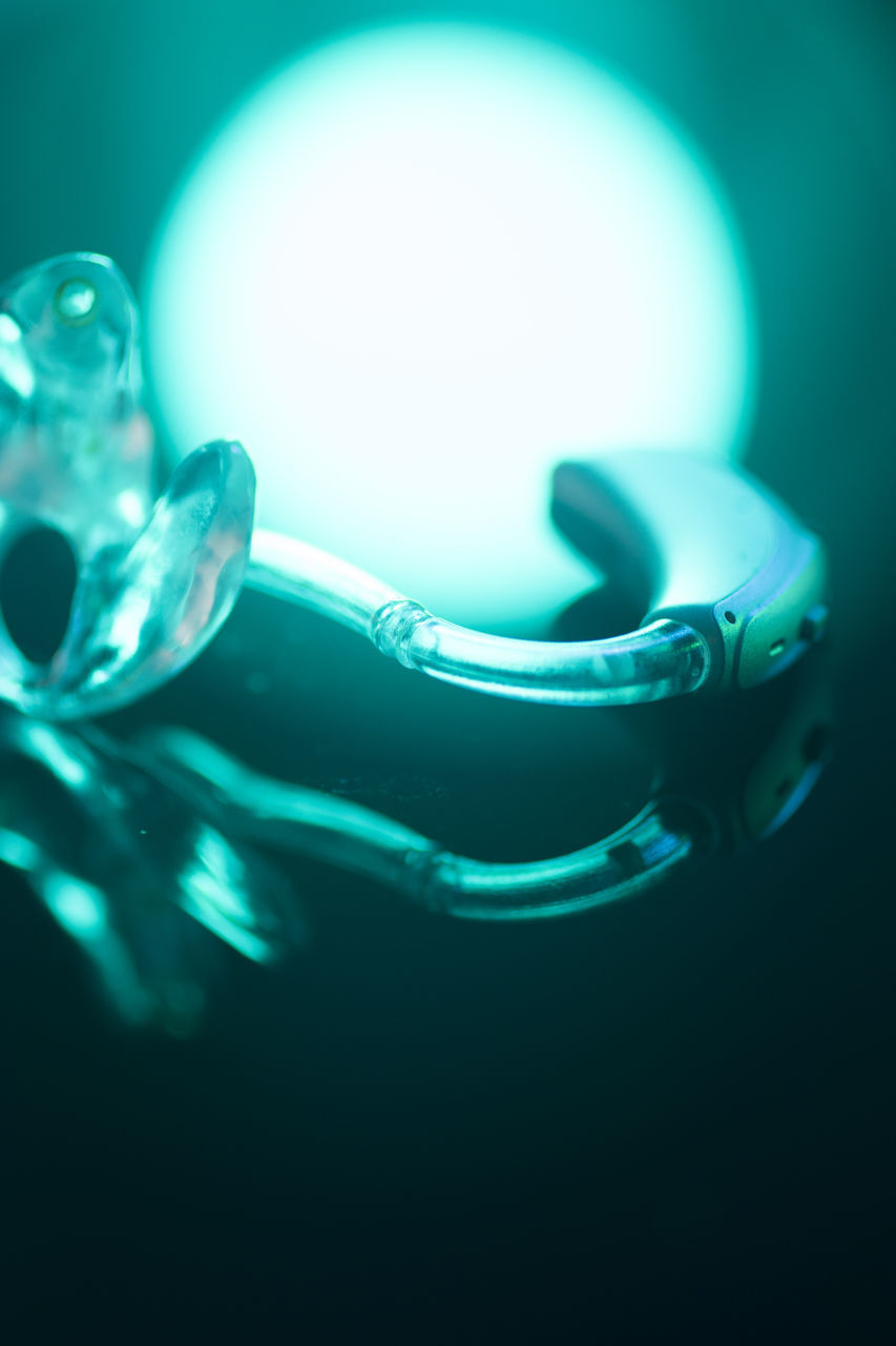 CLOSE-UP OF WATER DROP ON GLASS TABLE