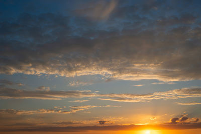 Low angle view of dramatic sky during sunset