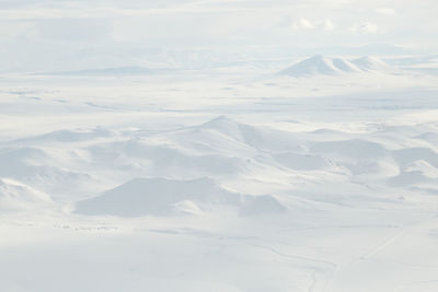 Scenic view of snow covered landscape against sky