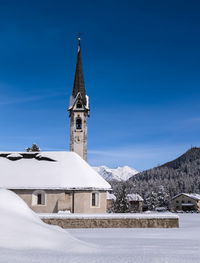 Low angle view of church against clear blue sky