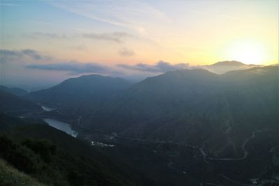 Scenic view of mountains against sky during sunset