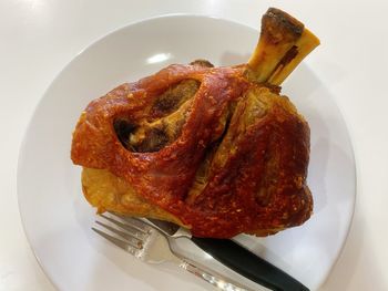 High angle view of meat in plate on table