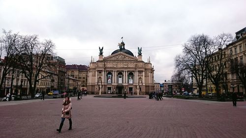 Low angle view of building against cloudy sky