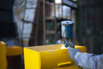 Close-up of man working on metal