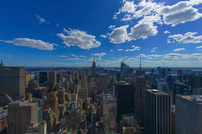 Aerial view of cityscape against sky