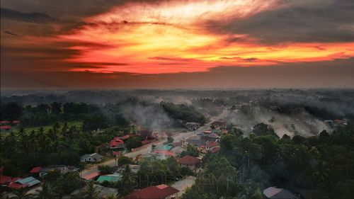 High angle view of landscape against orange sky