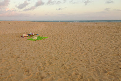 Man on beach against sky