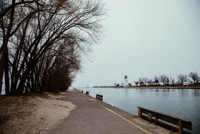 Scenic view of coast against clear sky