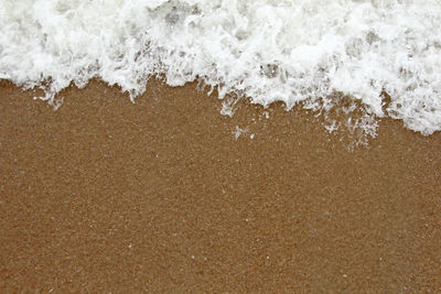 High angle view of surf on beach
