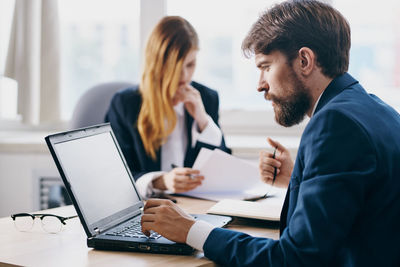 Business colleagues working at office