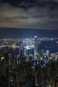 Aerial view of city lit up at night