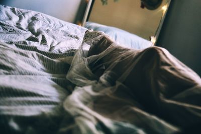 Close-up of blanket on bed at home