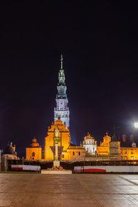 Illuminated buildings in city at night