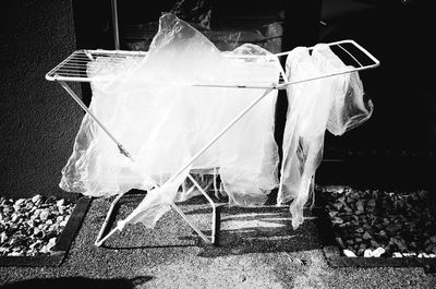 Clothes drying on sidewalk in city