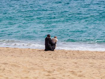 Rear view of man on beach