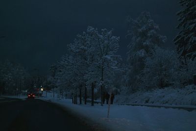 Road passing through snow covered landscape