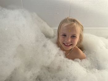 High angle view of young woman swimming in bathroom