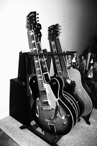 Close-up of guitar against wall