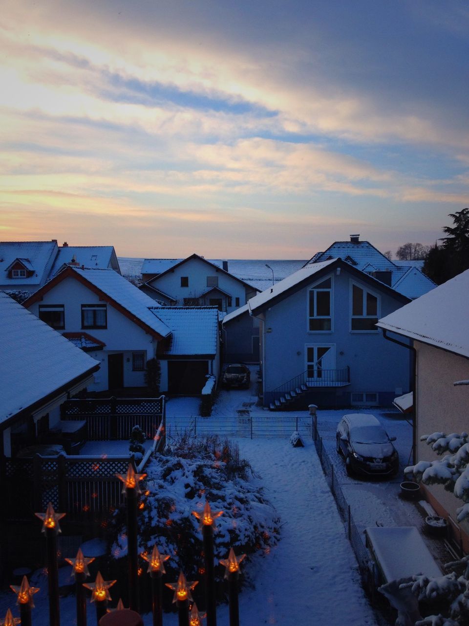 snow, winter, building exterior, cold temperature, architecture, built structure, sky, season, cloud - sky, weather, house, sunset, residential structure, residential building, covering, cloudy, frozen, nature, cloud, outdoors