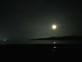 Scenic view of sea against sky at night