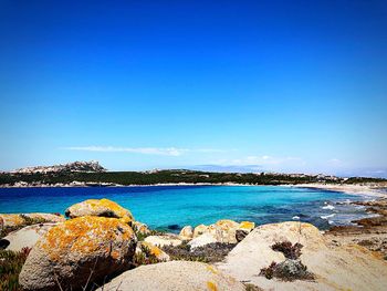 Scenic view of sea against clear blue sky