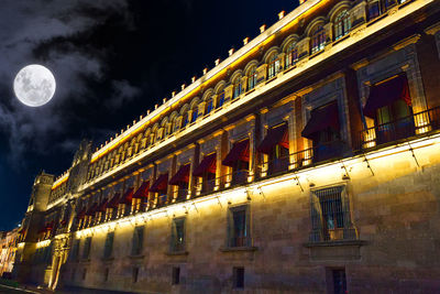 Low angle view of illuminated building at night