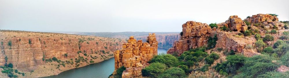 Panoramic view of rock formations against sky