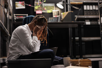 Young woman using mobile phone in cafe