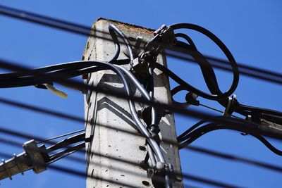 Low angle view of metallic structure against clear blue sky
