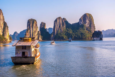 Panoramic view of boats in sea against sky