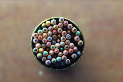 High angle view of multi colored pencils in container