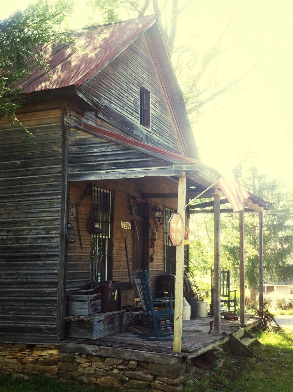 ABANDONED BUILDING AGAINST TREES