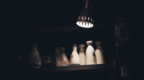 Close-up of wine bottles on glass