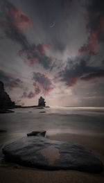 Scenic view of sea against sky at sunset