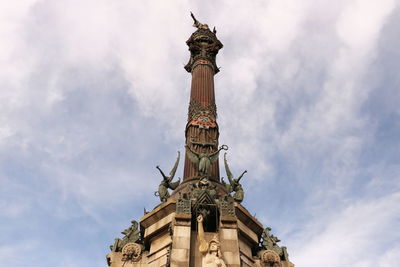 Low angle view of statue of liberty against sky