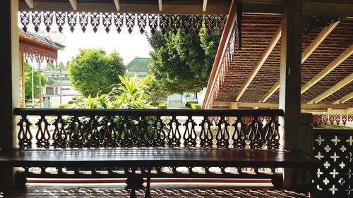 Trees seen through balcony of house