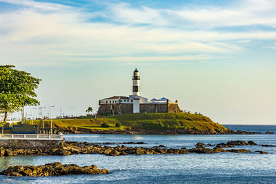 View of the famous lighthouse in the all saints bay in the city of salvador, bahia