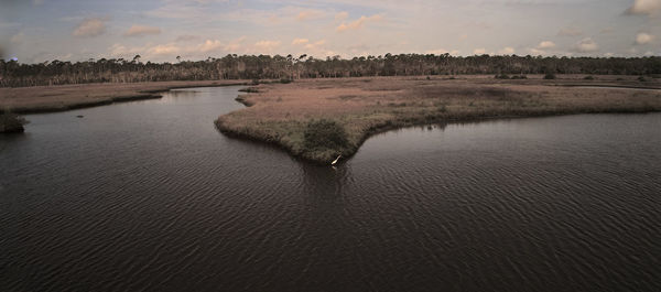 Scenic view of river against sky