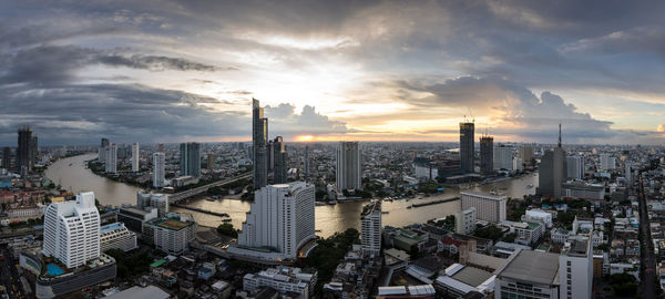 High angle view of city buildings during sunset