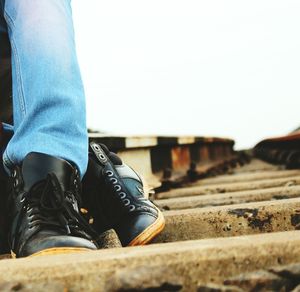 Low section of man standing outdoors