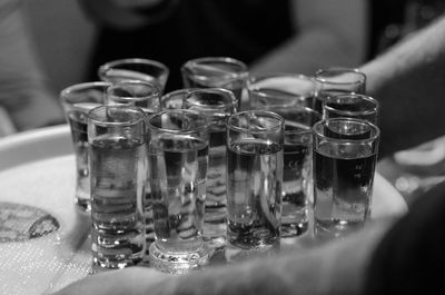 Close-up of wine glasses on table