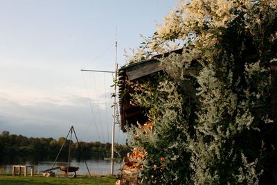 Sailboat by sea against sky