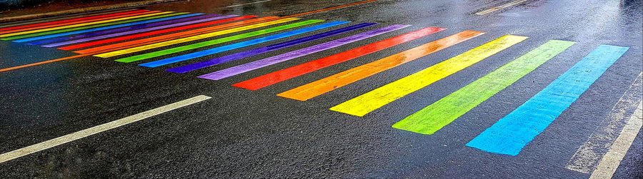 High angle view of multi colored pencils on road