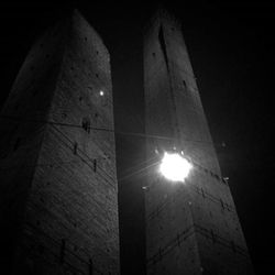 Low angle view of built structure against sky at night