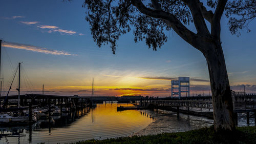 View of harbor at sunset