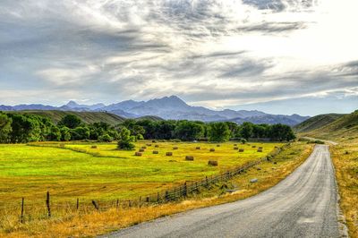 Road passing through field