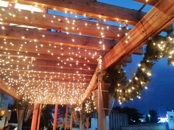 Low angle view of illuminated built structure at night