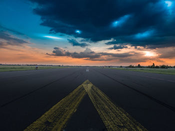 Airport runway at tempelhofer feld against cloudy sky at dusk